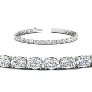 oval-shaped-13-carat-basket-tennis-bracelet-in-white-gold-fdbrc10444angle2-13.00-ct-nl-wg
